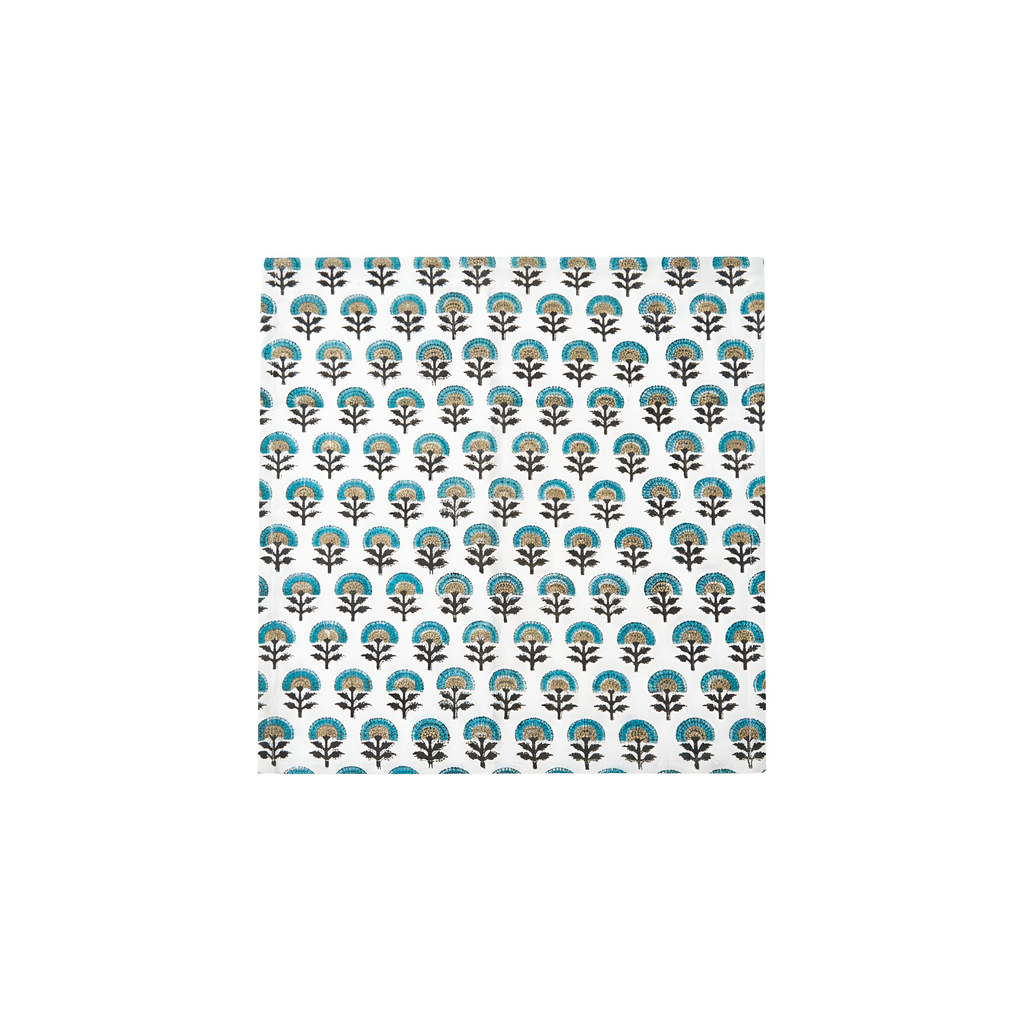 Blue, black, and beige floral pattern napkin on white background.