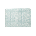 Floral patterned placemat on white background.