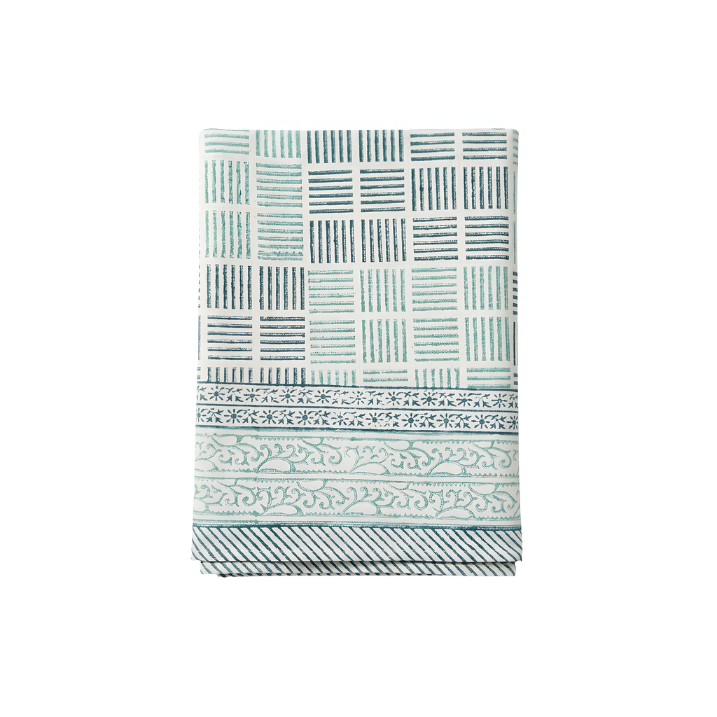 Tablecloth with geometric and floral pattern on a white background.