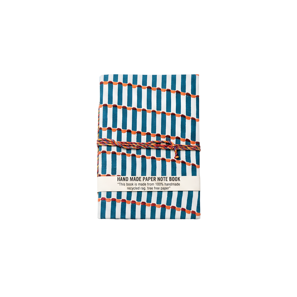Geometric patterned notebook with orange string on a white background