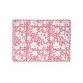 Floral patterned placemat with pink and white design on a white background